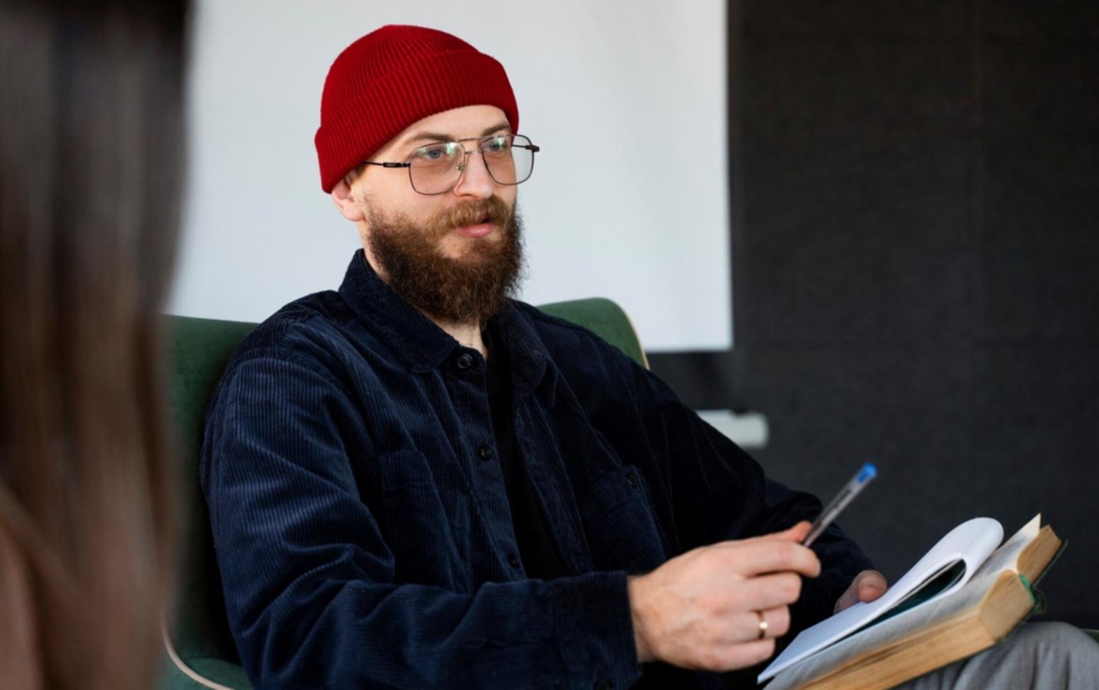 Investment professional analyzing market data on multiple computer screens showing real-time financial charts